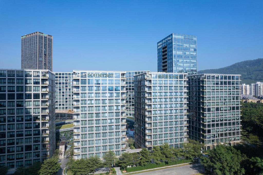 a group of tall buildings in a city at Somerset QPlex Shenzhen in Shenzhen