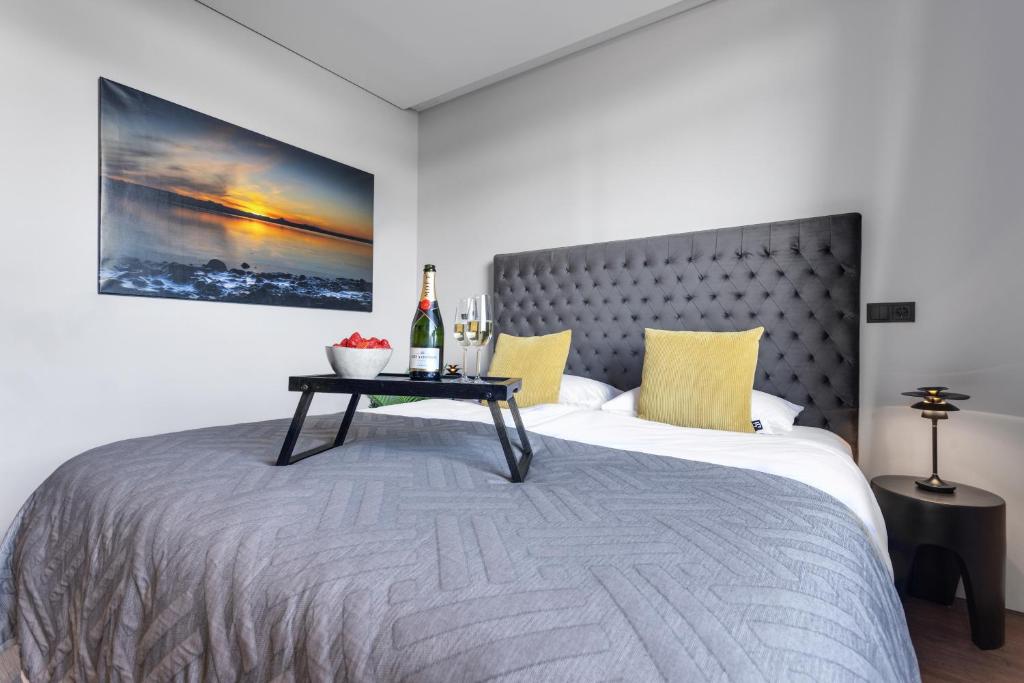 Postel nebo postele na pokoji v ubytování ALVA Apartments