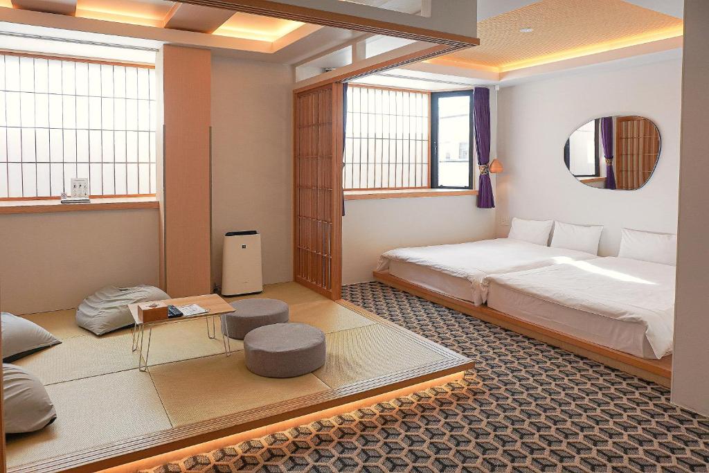 Postel nebo postele na pokoji v ubytování Hotel Imagine Kyoto