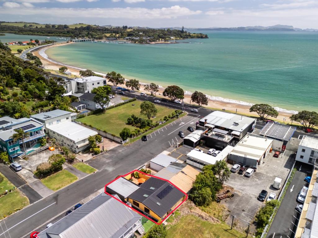 an aerial view of a town next to the ocean at Viva Vida View - Paihia Holiday Home in Paihia