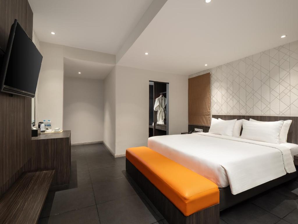 Postel nebo postele na pokoji v ubytování Swiss-Belinn Medan