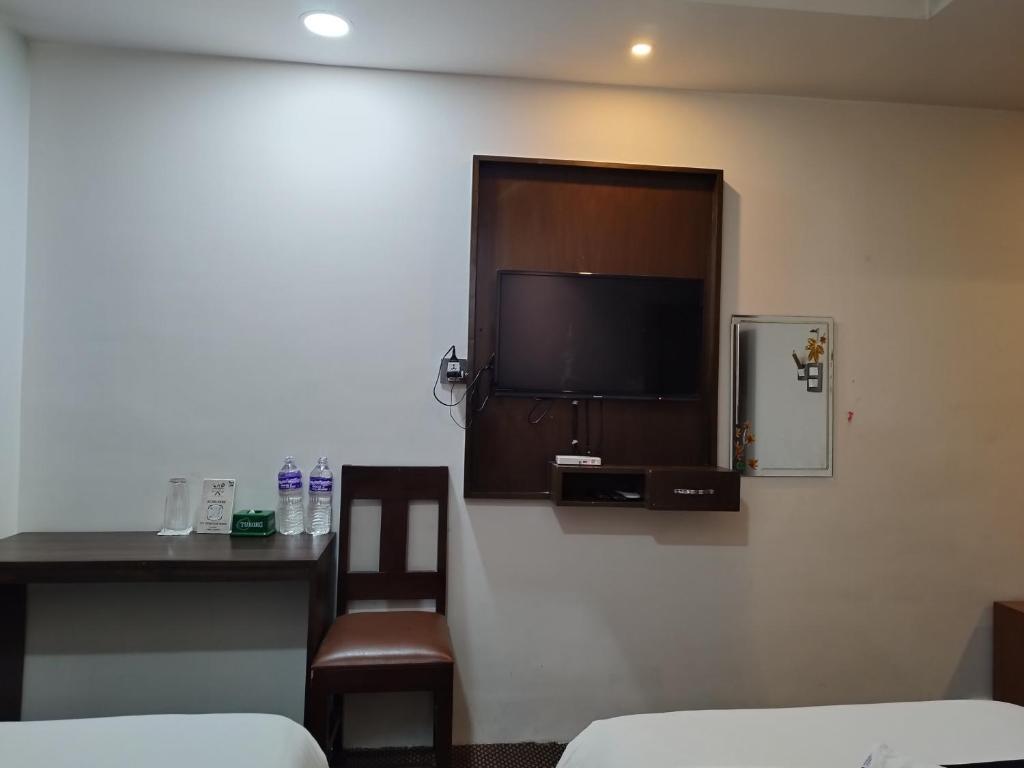 Postel nebo postele na pokoji v ubytování Hotel De Universal