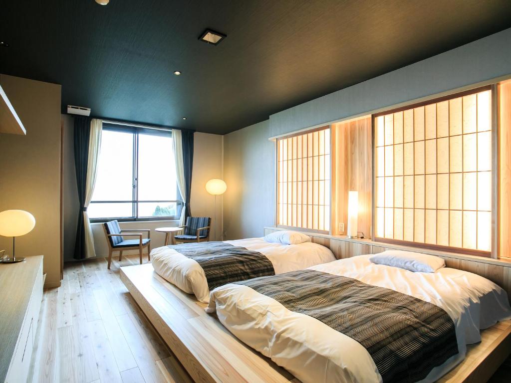 Postel nebo postele na pokoji v ubytování Setre Highland Villa Himeji