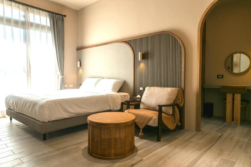 Postel nebo postele na pokoji v ubytování Yuzhi Wenlv B&B