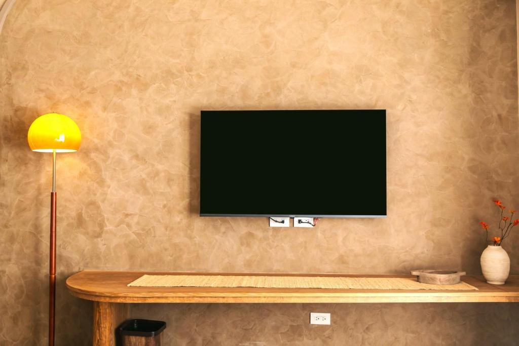 TV a/nebo společenská místnost v ubytování Yuzhi Wenlv B&B