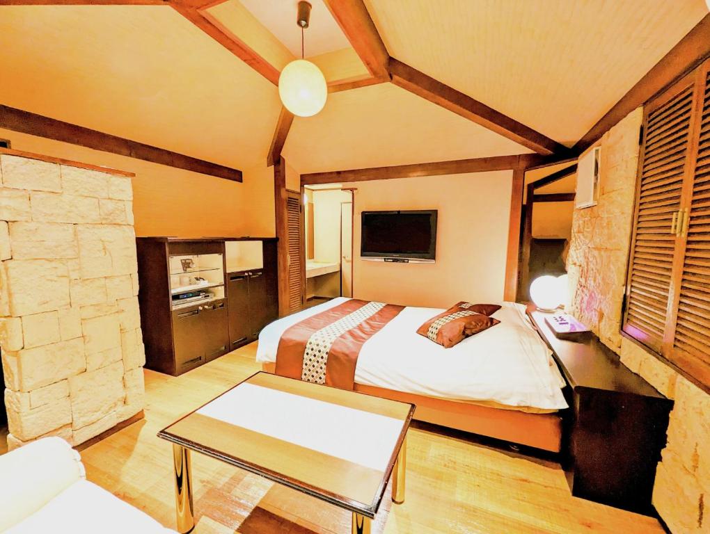 Postel nebo postele na pokoji v ubytování Hotel P'sResort Adults only 大人専用