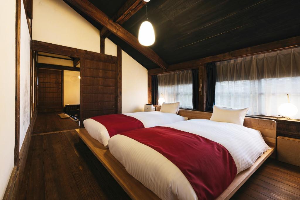 Postel nebo postele na pokoji v ubytování PAAK Hotel