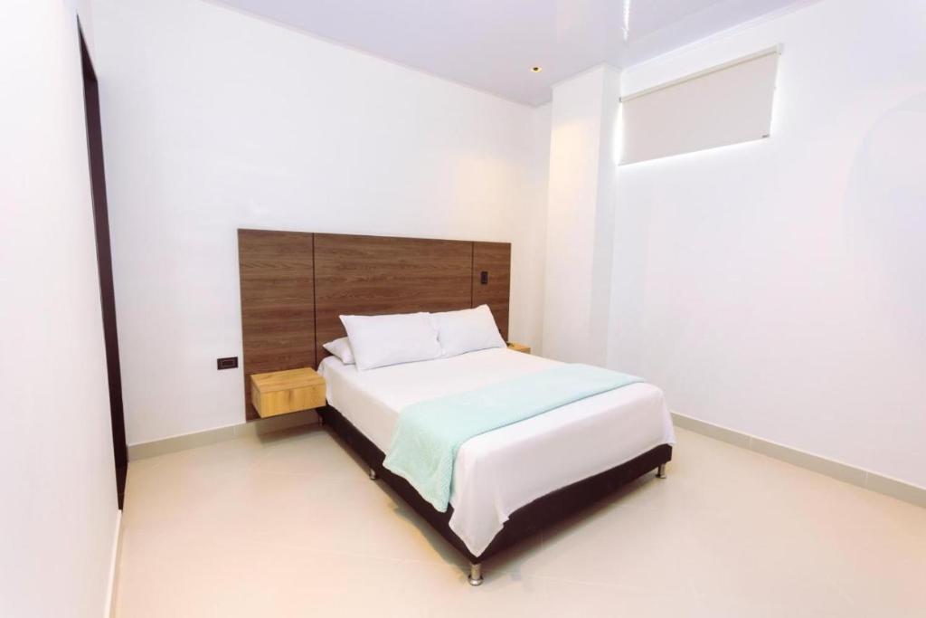 Postel nebo postele na pokoji v ubytování Hotel Luna Verde