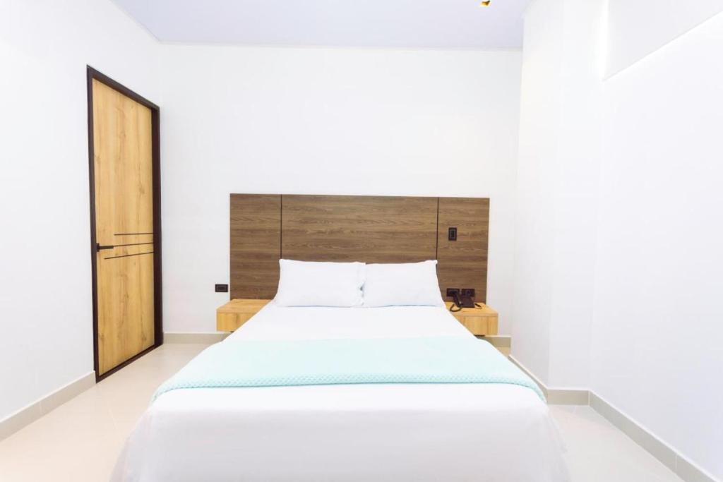 Postel nebo postele na pokoji v ubytování Hotel Luna Verde