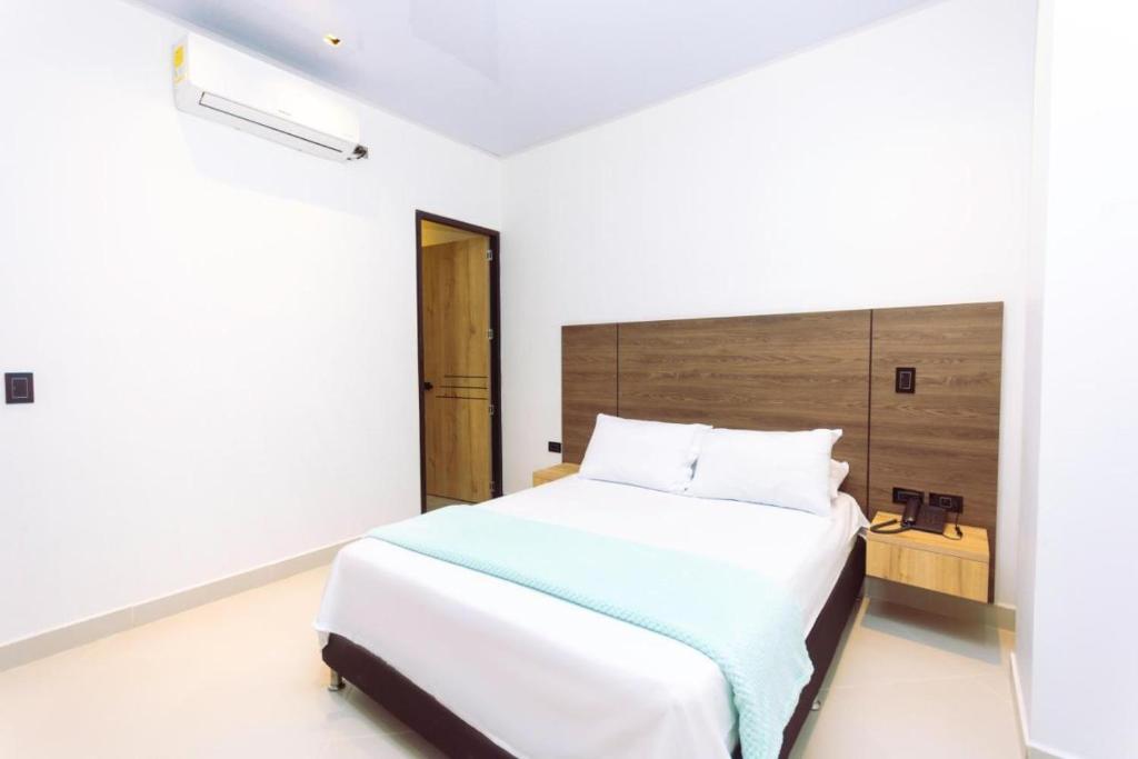 Postel nebo postele na pokoji v ubytování Hotel Luna Verde