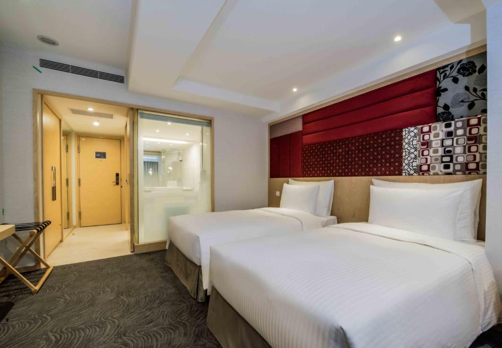 Postel nebo postele na pokoji v ubytování Sonnien Hotel
