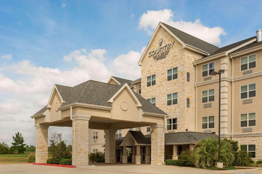 a rendering of a hotel with a building at Country Inn & Suites by Radisson, Texarkana, TX in Texarkana - Texas