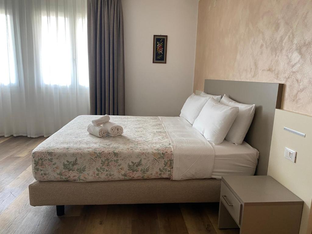 Postel nebo postele na pokoji v ubytování Hotel Lanterna Padova
