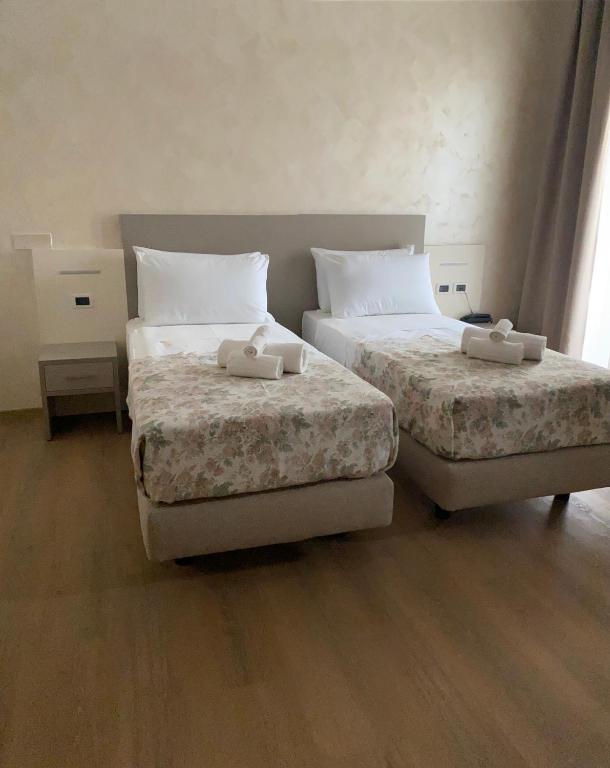 Postel nebo postele na pokoji v ubytování Hotel Lanterna Padova