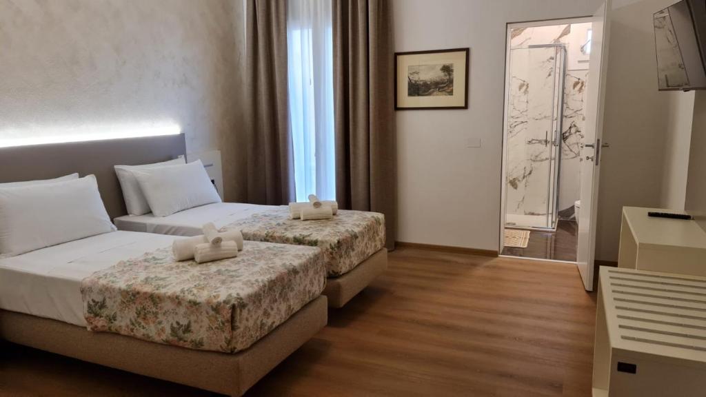 Postel nebo postele na pokoji v ubytování Hotel Lanterna Padova