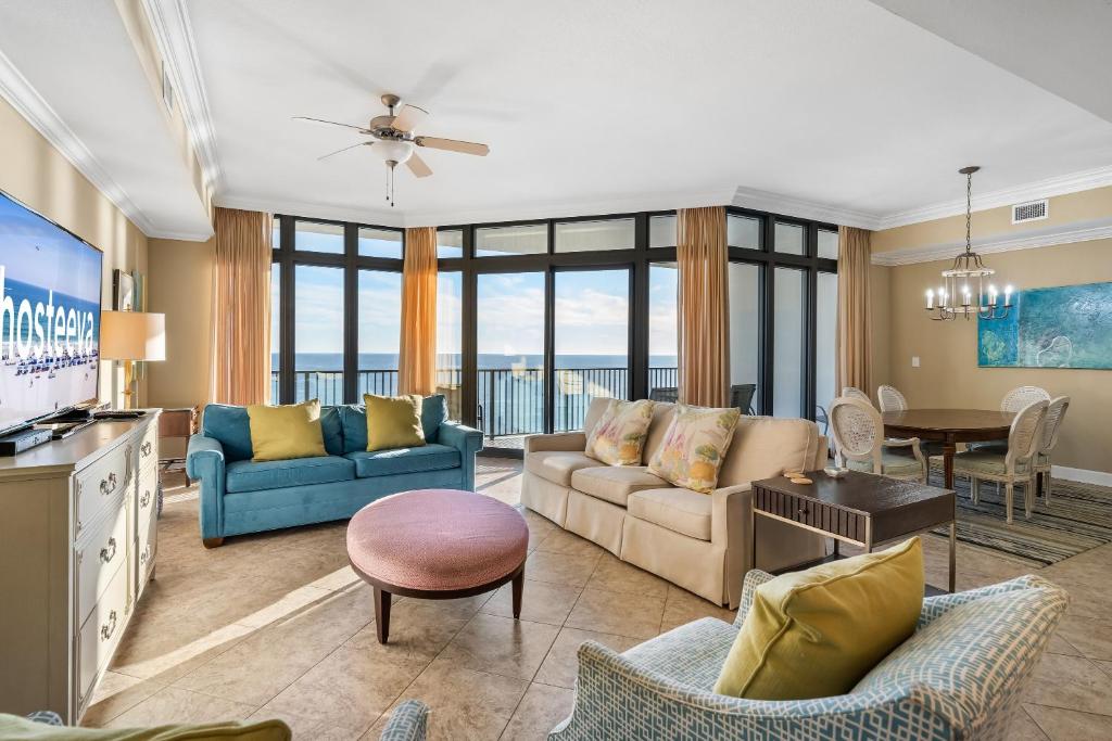 a living room with a couch and a table at Oasis at Orange Beach 1102 in Orange Beach