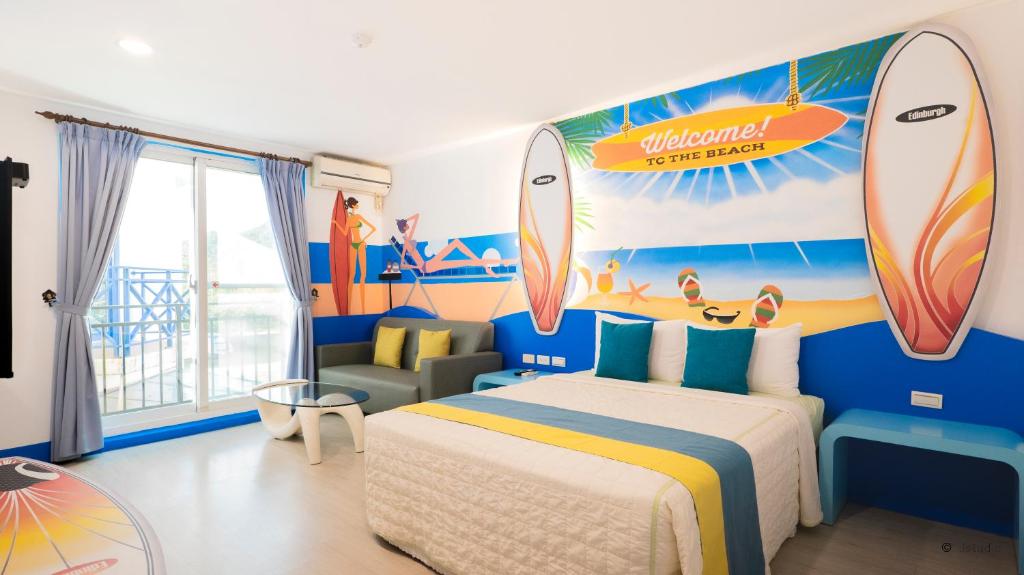 a bedroom with a bed and surfboards on the wall at Ocean Star B&B in Kenting
