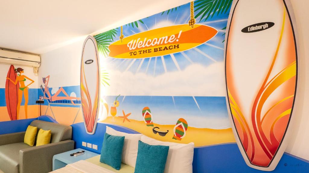 a room with surfboards painted on the wall at Ocean Star B&B in Kenting
