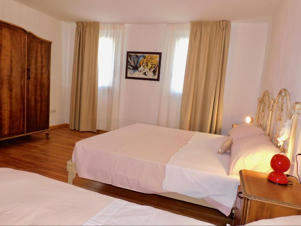 Postel nebo postele na pokoji v ubytování b&b Tati