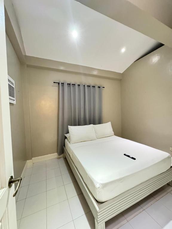 Postel nebo postele na pokoji v ubytování Red Coco Inn de Boracay