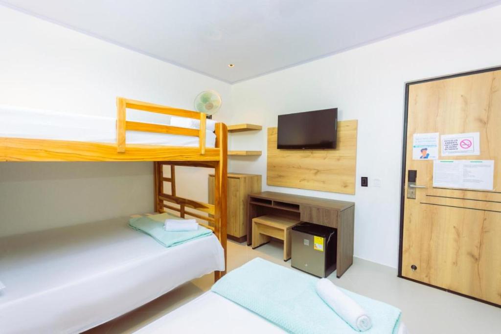 Postel nebo postele na pokoji v ubytování Hotel Luna Verde
