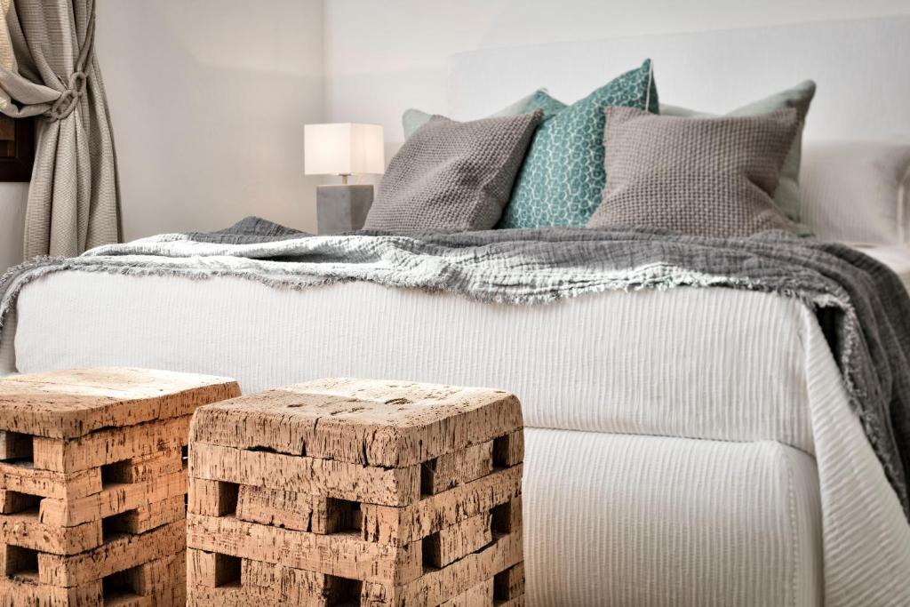 Łóżko lub łóżka w pokoju w obiekcie Cascioni Eco Retreat