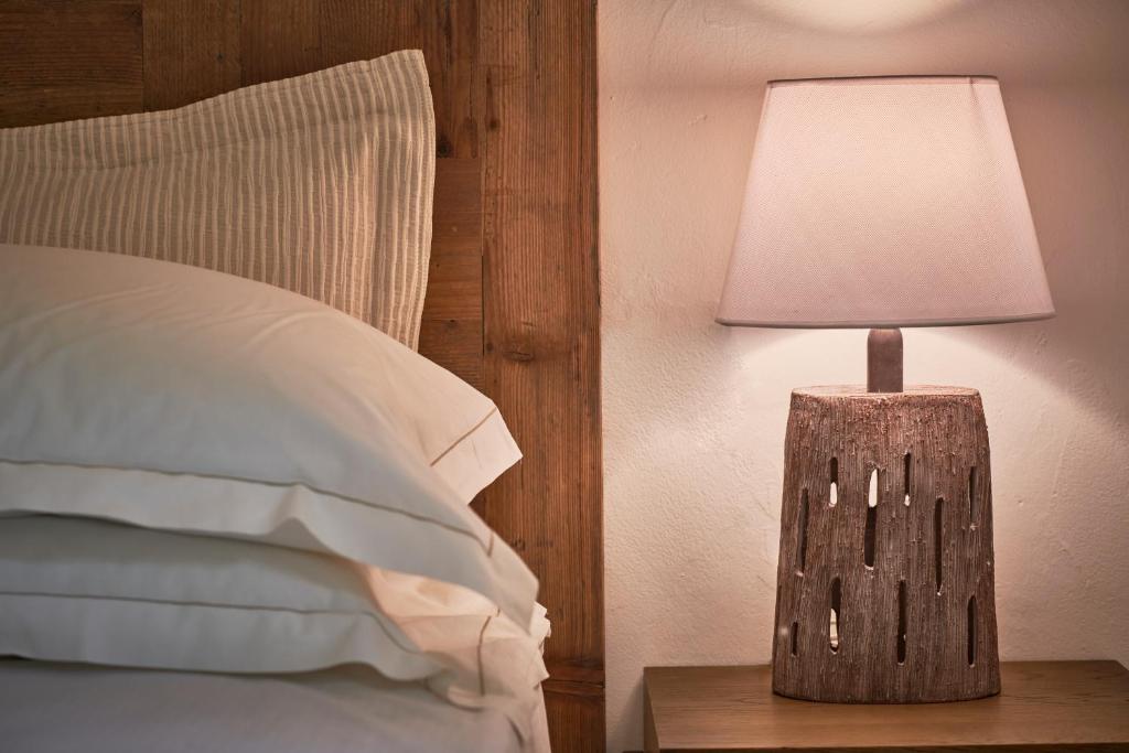 Łóżko lub łóżka w pokoju w obiekcie Cascioni Eco Retreat
