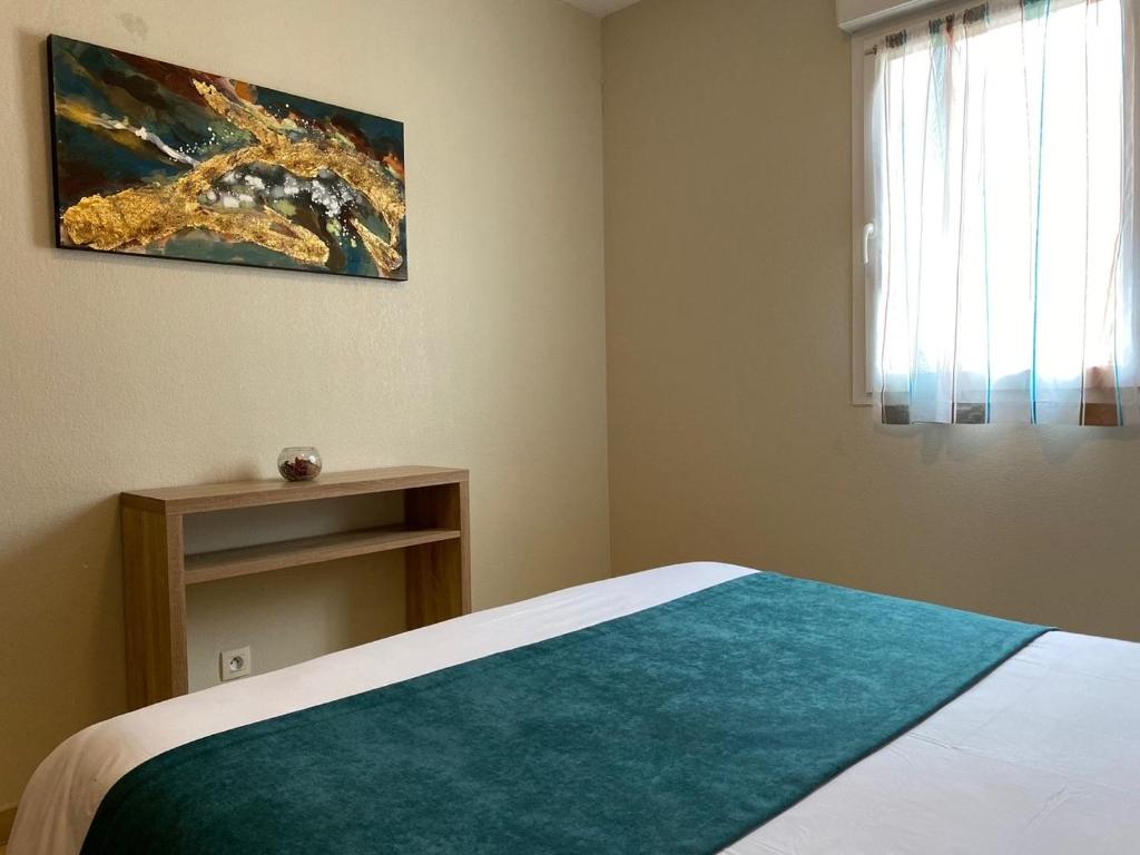 Postel nebo postele na pokoji v ubytování Calvi Résidence, Appart'hôtel