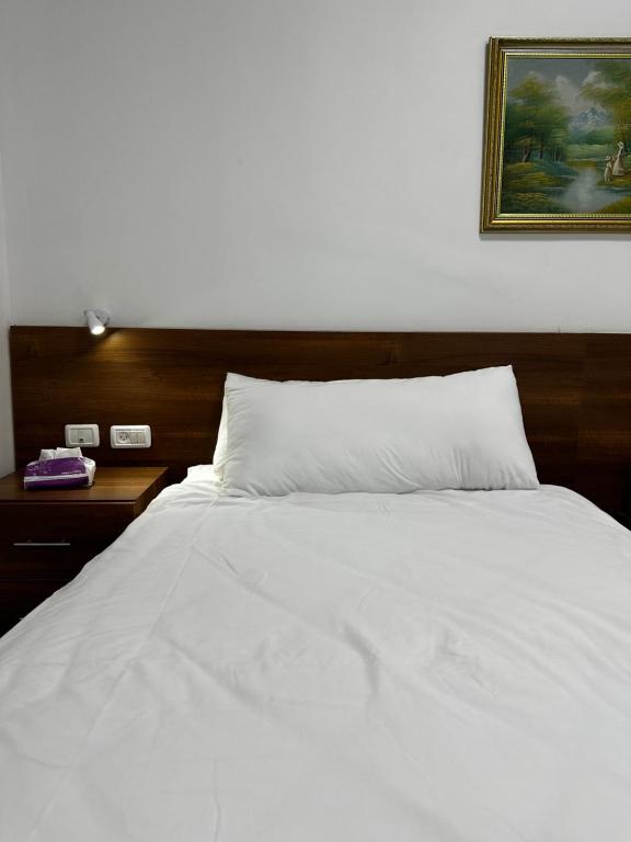 Postel nebo postele na pokoji v ubytování Shepherd Hotel