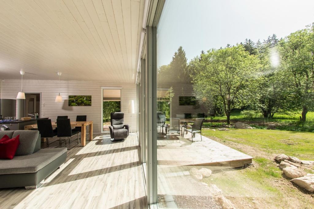 an open patio with a couch and a table at 2 bis 4 Personen F3H2 in Ruhla