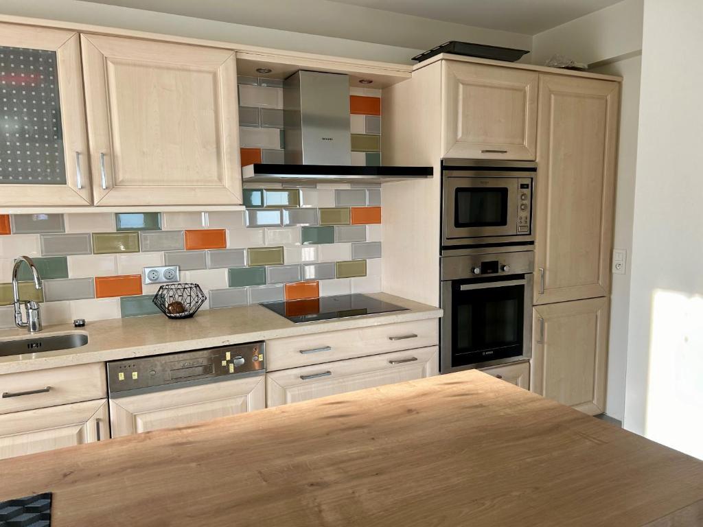 Kuchyňa alebo kuchynka v ubytovaní Bella vista luxe 2 chambres