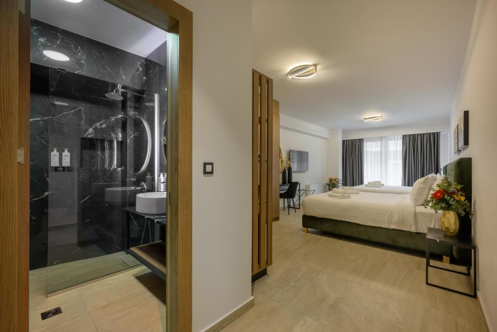Postel nebo postele na pokoji v ubytování Cens Silver Luxury Suites