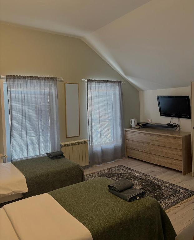 Postel nebo postele na pokoji v ubytování MiniCity Inn