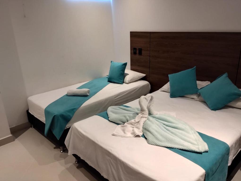 Postel nebo postele na pokoji v ubytování Hotel Luna Verde