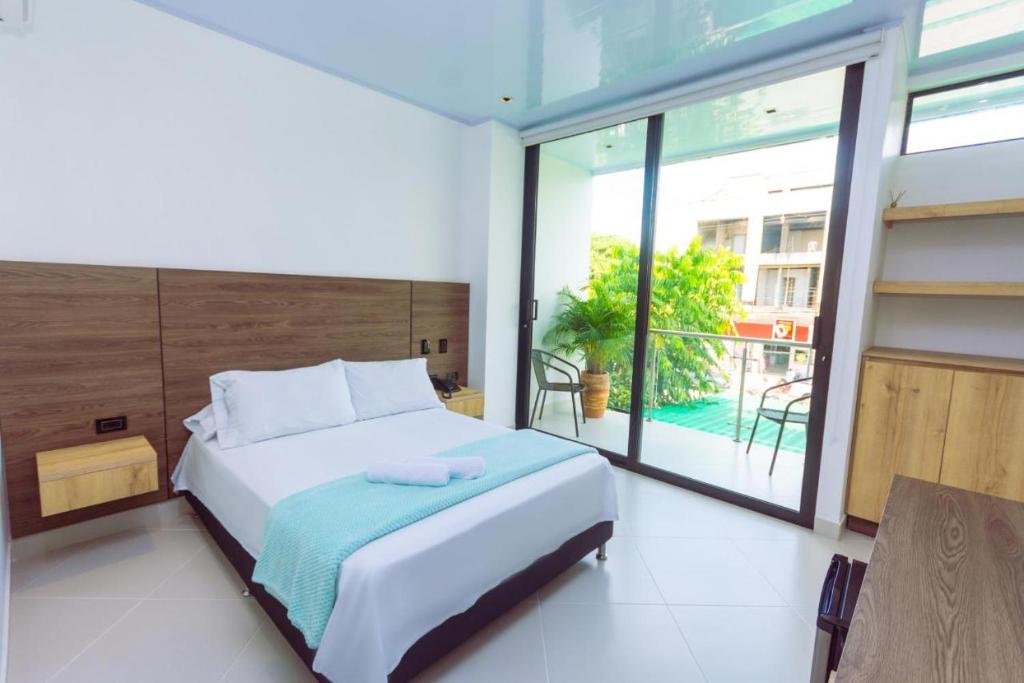 Postel nebo postele na pokoji v ubytování Hotel Luna Verde