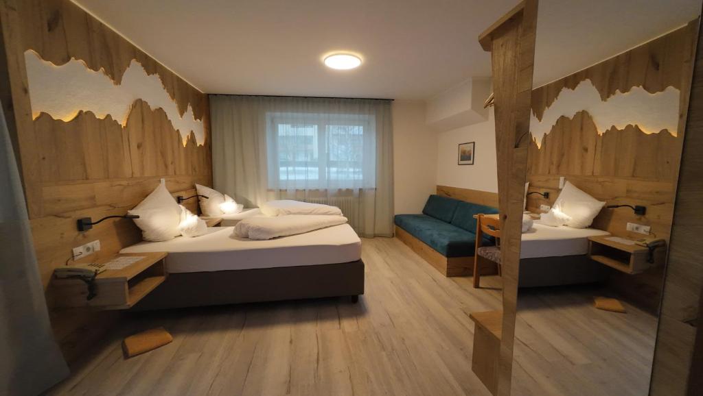 Postel nebo postele na pokoji v ubytování Hotel Akelei