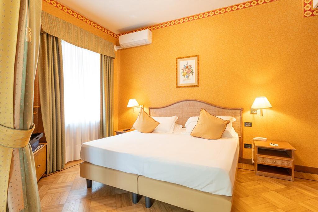 Postel nebo postele na pokoji v ubytování Park Hotel Villa Ariston