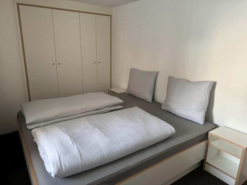 Postel nebo postele na pokoji v ubytování Homebase by Revier