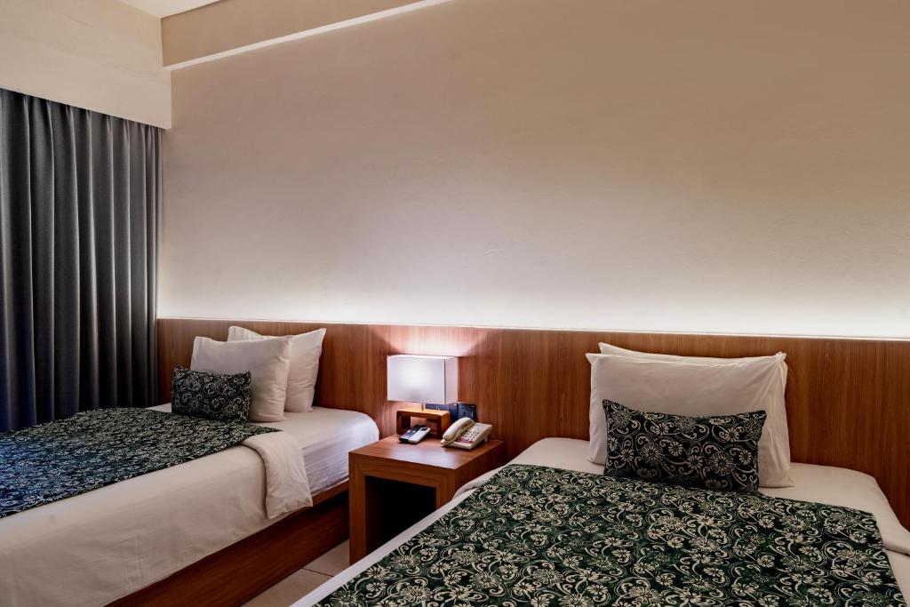 Postel nebo postele na pokoji v ubytování Tusita Boutique Hotel