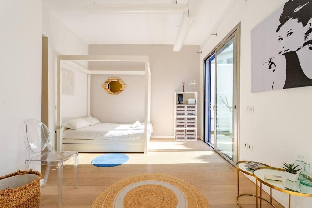 Postel nebo postele na pokoji v ubytování Villa Itaca Vista mar y piscina climatizada
