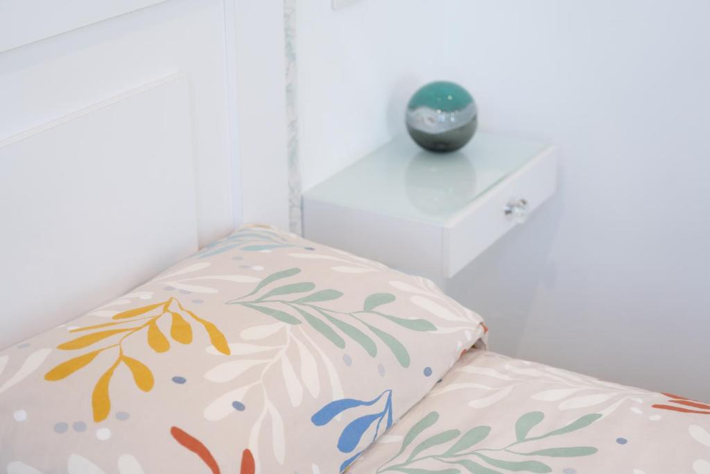 A bed or beds in a room at Luxury Poolside Holiday Home