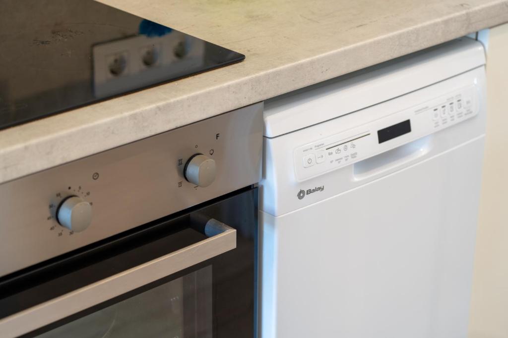 A kitchen or kitchenette at Luxury Poolside Holiday Home
