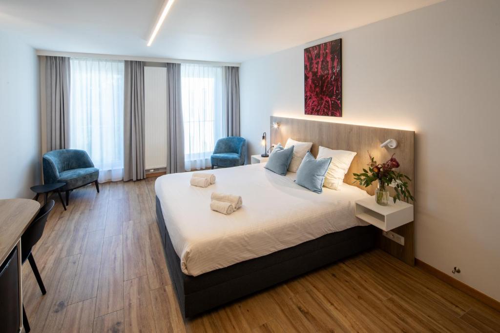 Postel nebo postele na pokoji v ubytování Hotel Den Briel