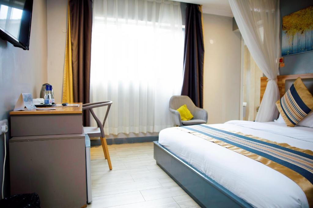 Postel nebo postele na pokoji v ubytování Raha Suites - Westlands