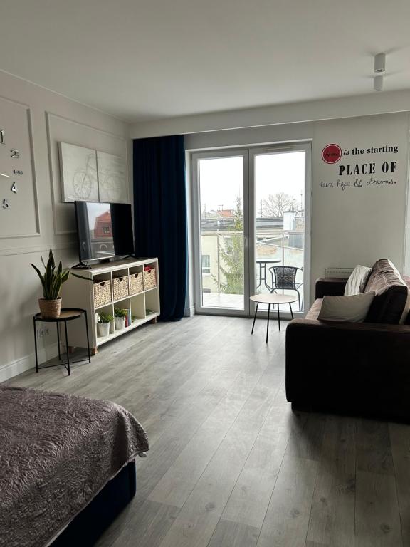 Posteľ alebo postele v izbe v ubytovaní Apartament City Centre 108