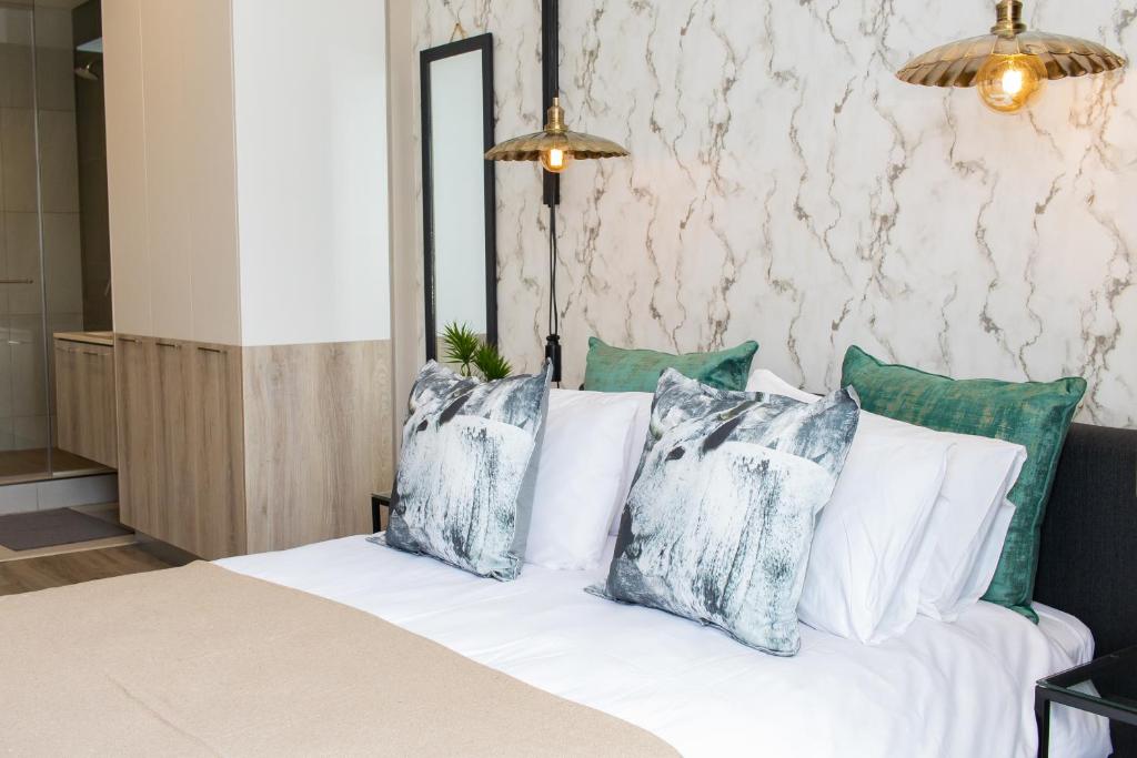 Postel nebo postele na pokoji v ubytování Menlyn Apartment