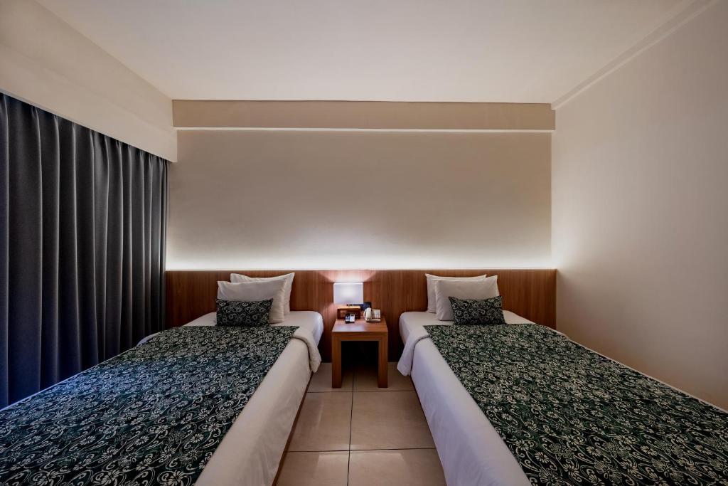 Postel nebo postele na pokoji v ubytování Tusita Boutique Hotel