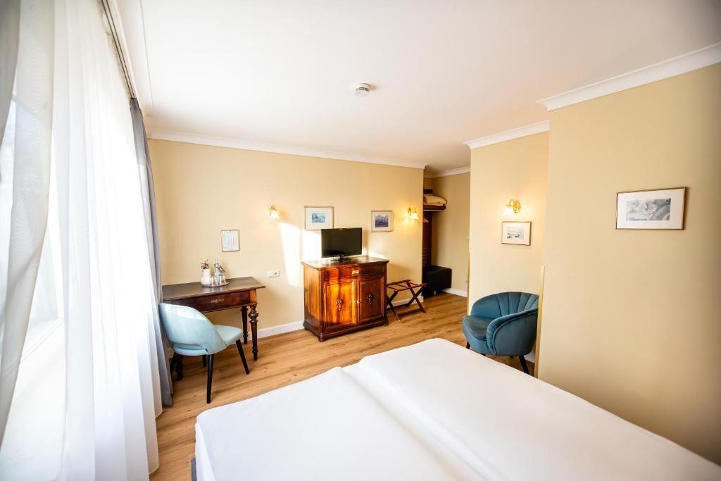 Postel nebo postele na pokoji v ubytování Hotel Altmünchen by Blattl