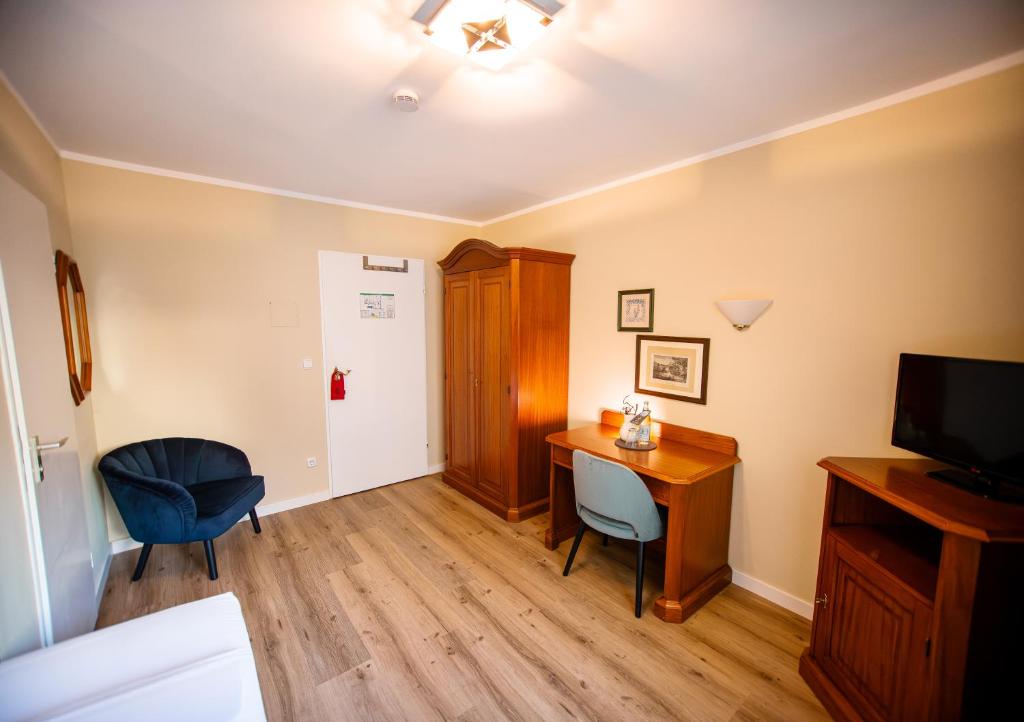 TV a/nebo společenská místnost v ubytování Hotel Altmünchen by Blattl