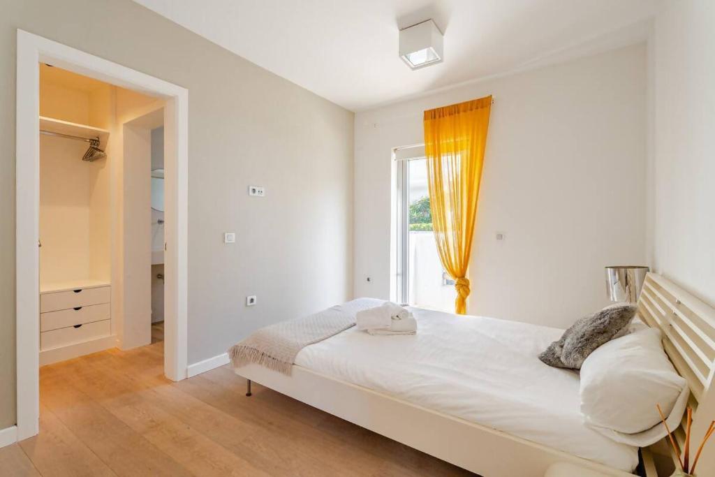 Postel nebo postele na pokoji v ubytování Villa Itaca Vista mar y piscina climatizada